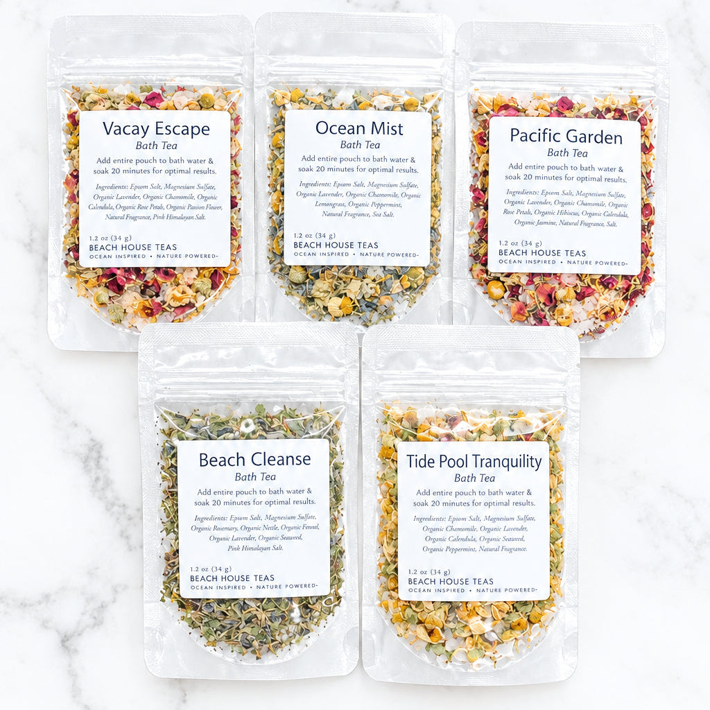 Five bath tea sample pouches labeled Vacay Escape, Ocean Mist, Pacific Garden, Beach Cleanse, and Tide Pool Tranquility