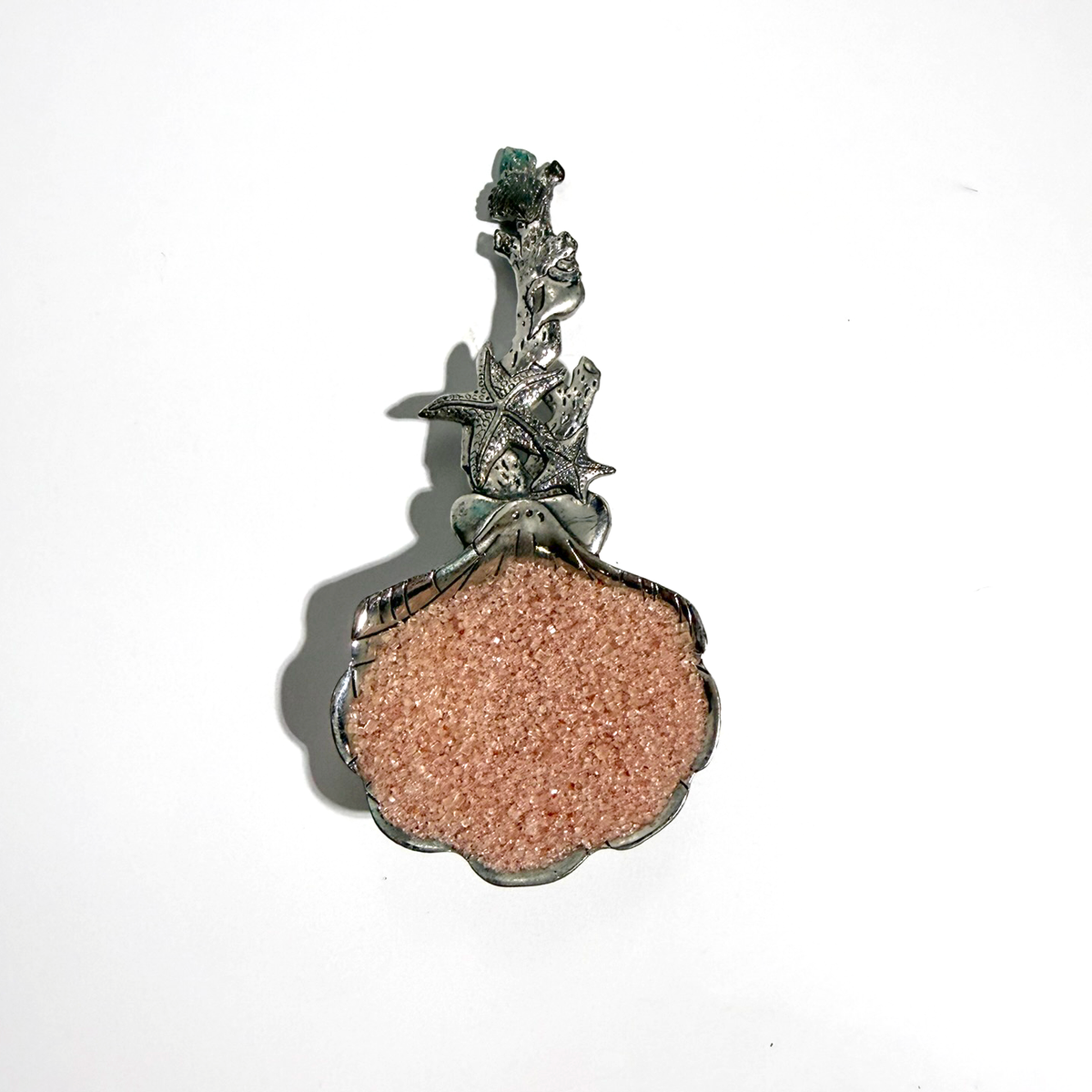 Beach House Teas blackberry infused sugar in a shell-shaped scoop with a decorative starfish handle