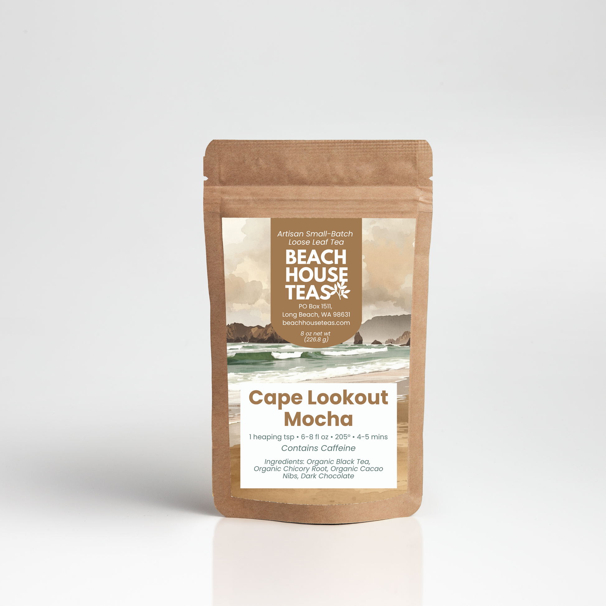 A stand-up kraft paper pouch of Beach House Teas Cape Lookout Mocha tea, featuring a central label with a coastal landscape and product details, set against a clean light gray background.