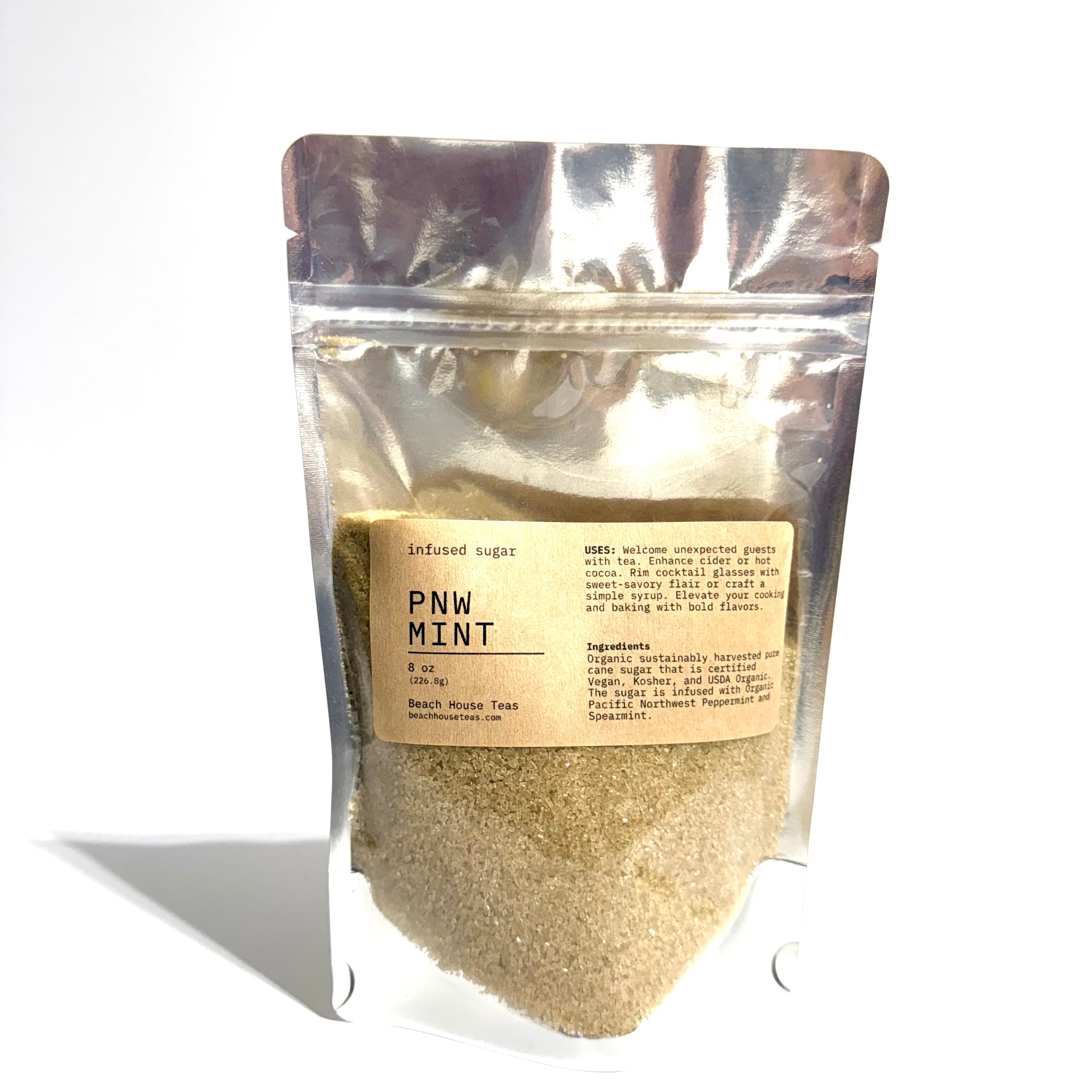 A stand-up pouch of PNW Mint flavored artificial sugar, showing the light brown granulated sugar inside through a clear lower section, with a beige label on a white background.