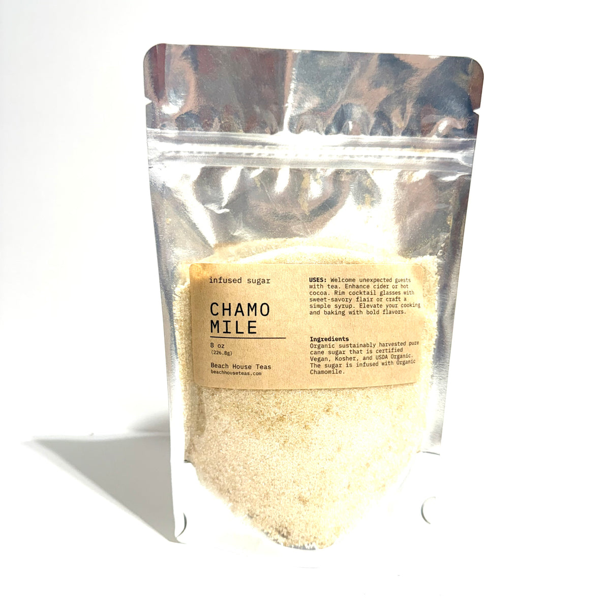 A stand-up resealable pouch of Chamo Mile refined sugar, showing the light beige sugar granules through a clear window and a tan label on a white background.