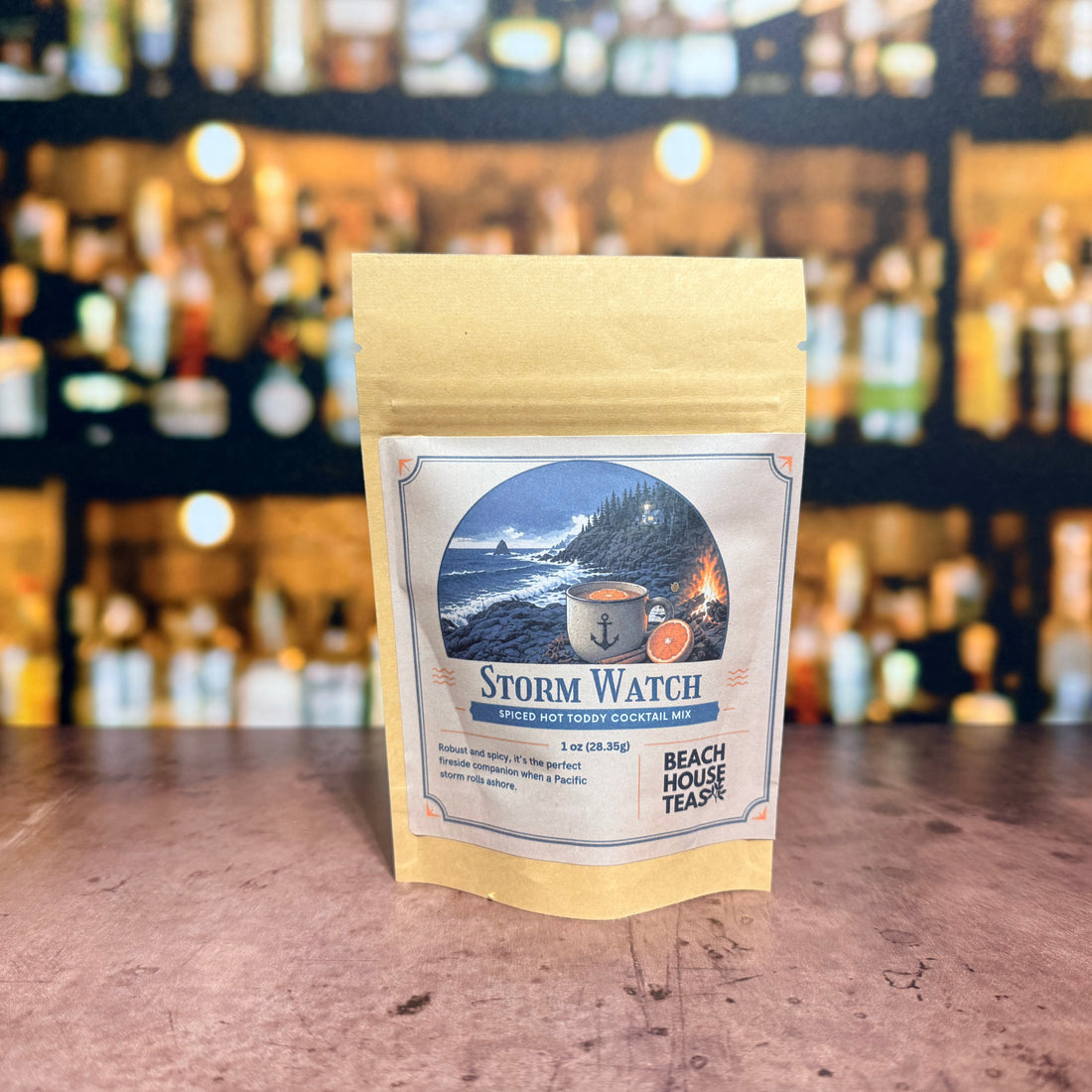 Storm Watch spiced hot toddy cocktail mix by Beach House Teas, 1 oz pouch on a bar counter.