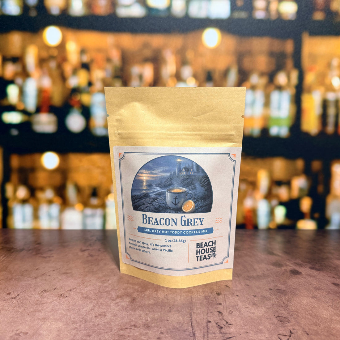 Beacon Grey Earl Grey hot toddy cocktail mix by Beach House Teas, 1 oz pouch on a bar counter.