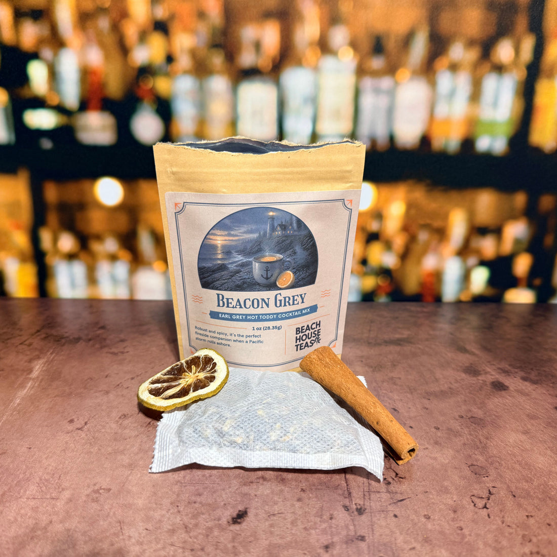 Beacon Grey Earl Grey hot toddy cocktail mix by Beach House Teas, 1 oz pouch on a bar counter.