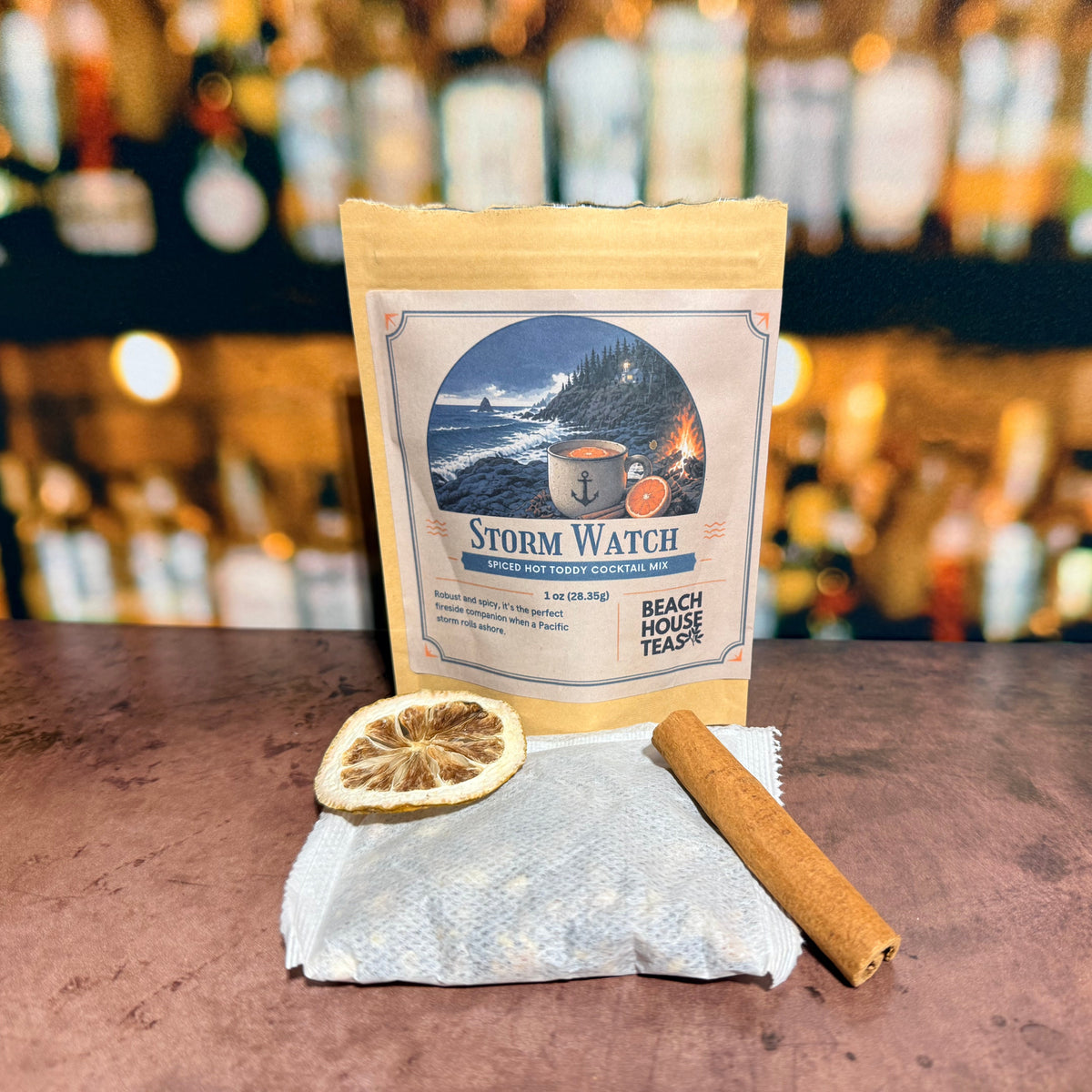 Storm Watch hot toddy mix pouch with a tea sachet, dried lemon slice, and cinnamon stick.