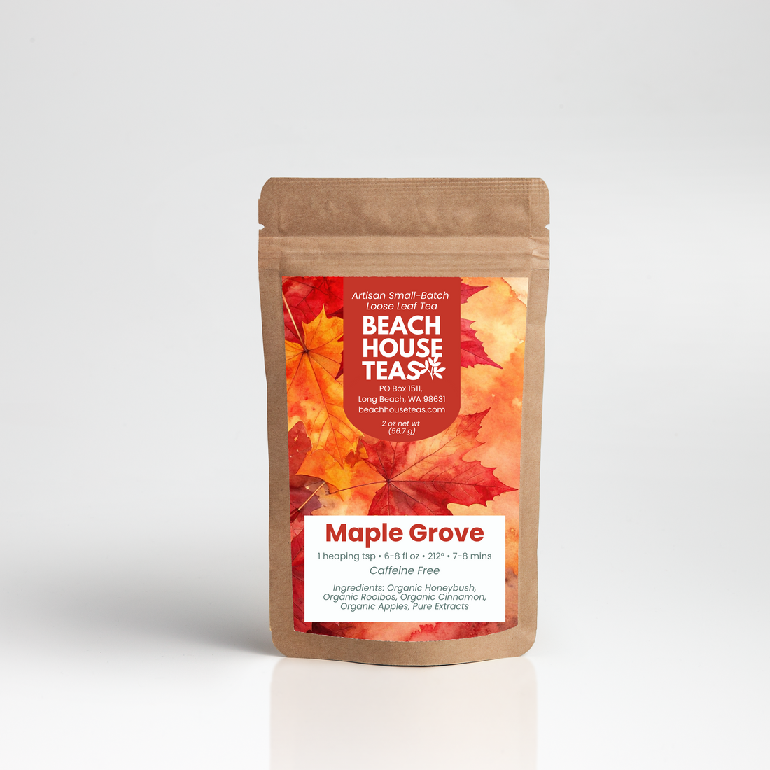 A stand-up kraft paper pouch of Beach House Teas Maple Grove organic herbal tea, featuring a red and orange leaf pattern label, set against a clean white background with a soft reflection.
