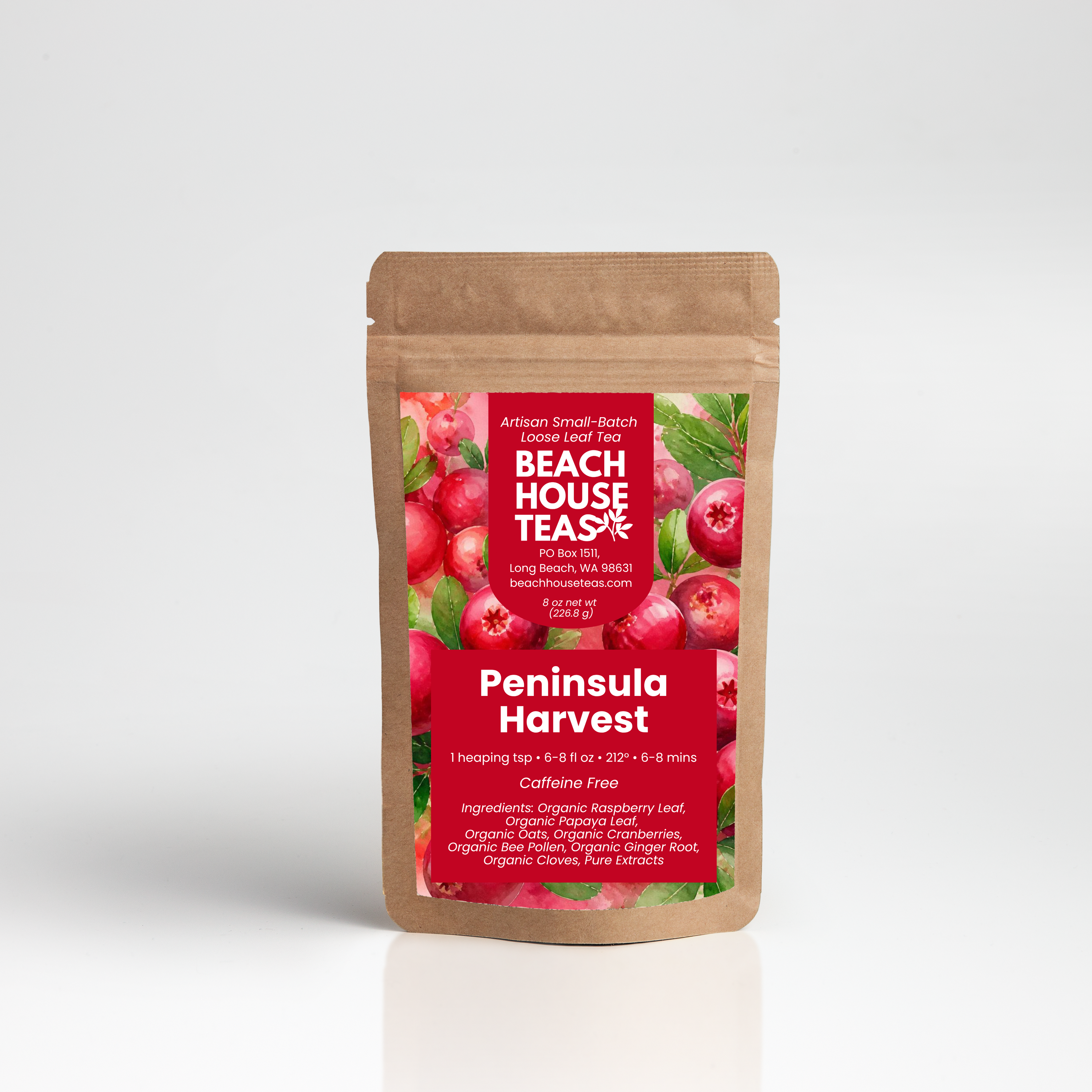 A stand-up kraft paper pouch of Beach House Teas 'Peninsula Harvest' loose leaf tea, featuring a red label with illustrations of fresh raspberries and green leaves, set against a clean white background.