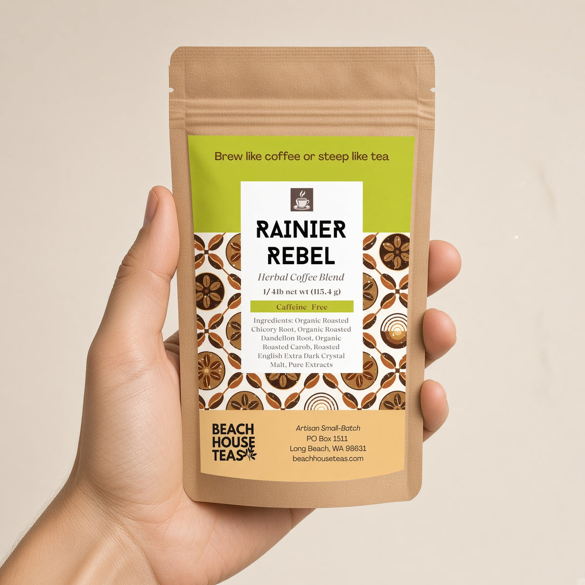Hand holding a Rainier Rebel herbal coffee quarter-pound kraft pouch against a light background