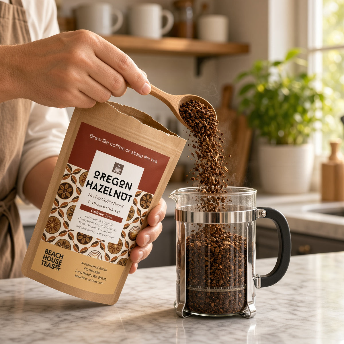 Person pouring Oregon Hazelnut herbal coffee from a wooden spoon into a glass French press beside the kraft pouch
