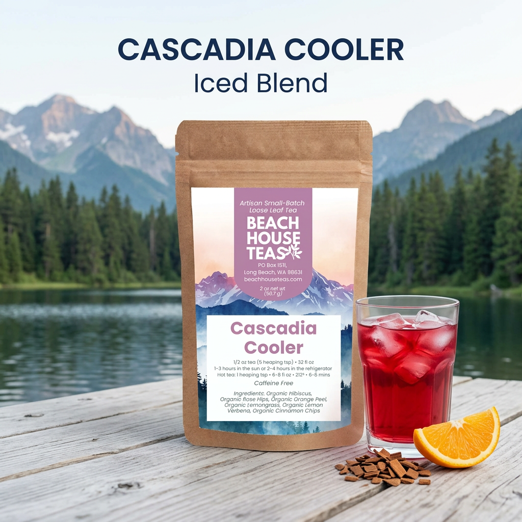 Cascadia Cooler Iced Blend pouch beside ruby-red iced herbal tea, orange and cinnamon chips at a mountain lake surrounded by evergreen forest.