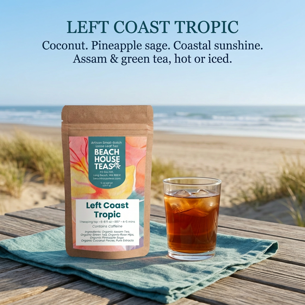 Left Coast Tropic tea pouch beside amber iced tea on a coastal deck overlooking sandy beach dunes. Coconut and pineapple sage with Assam and green tea, enjoyed hot or iced.