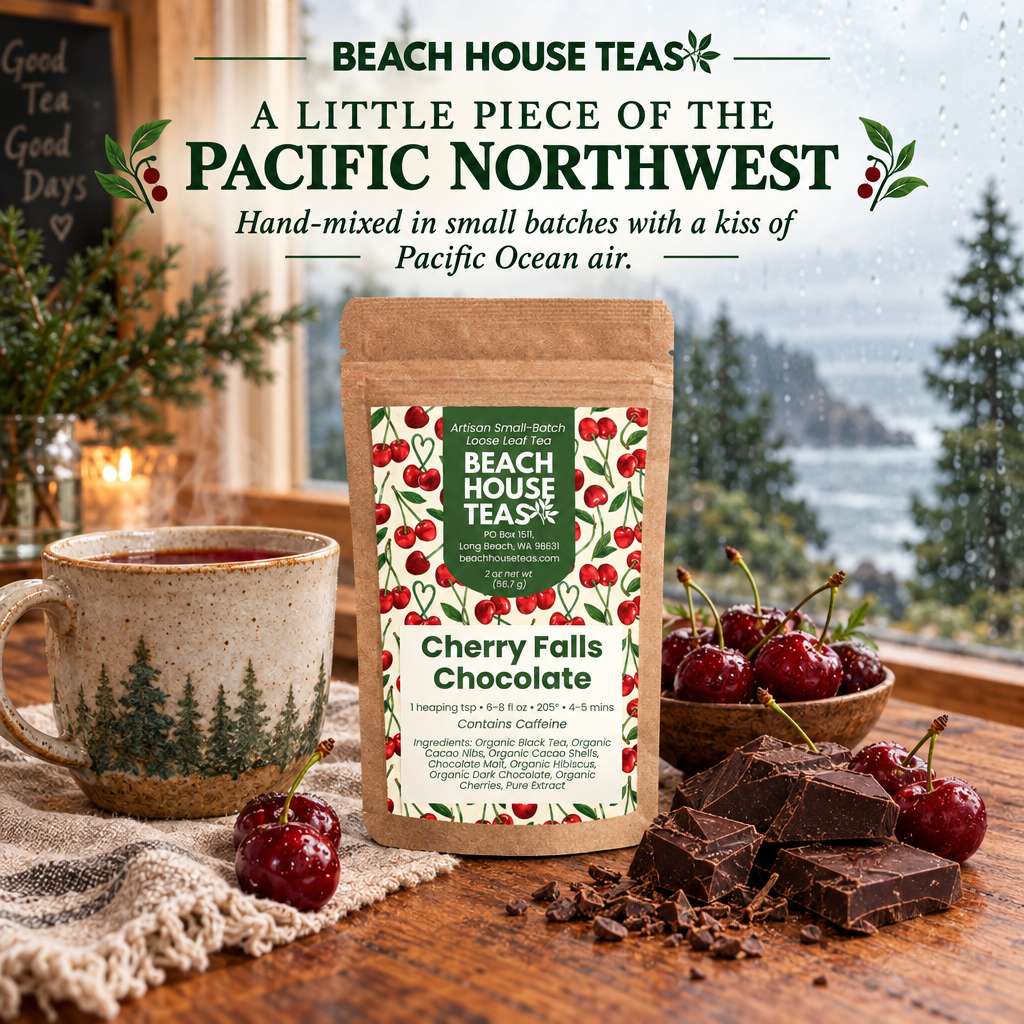 Cherry Falls Chocolate pouch and tea mug with cherries and dark chocolate beside a rainy Pacific Northwest cafe window.