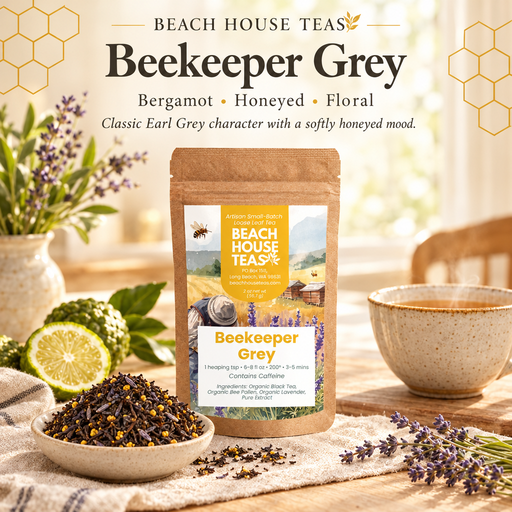 Beekeeper Grey pouch with loose tea, bergamot and lavender beside a warm tea cup in a sunlit breakfast nook.
