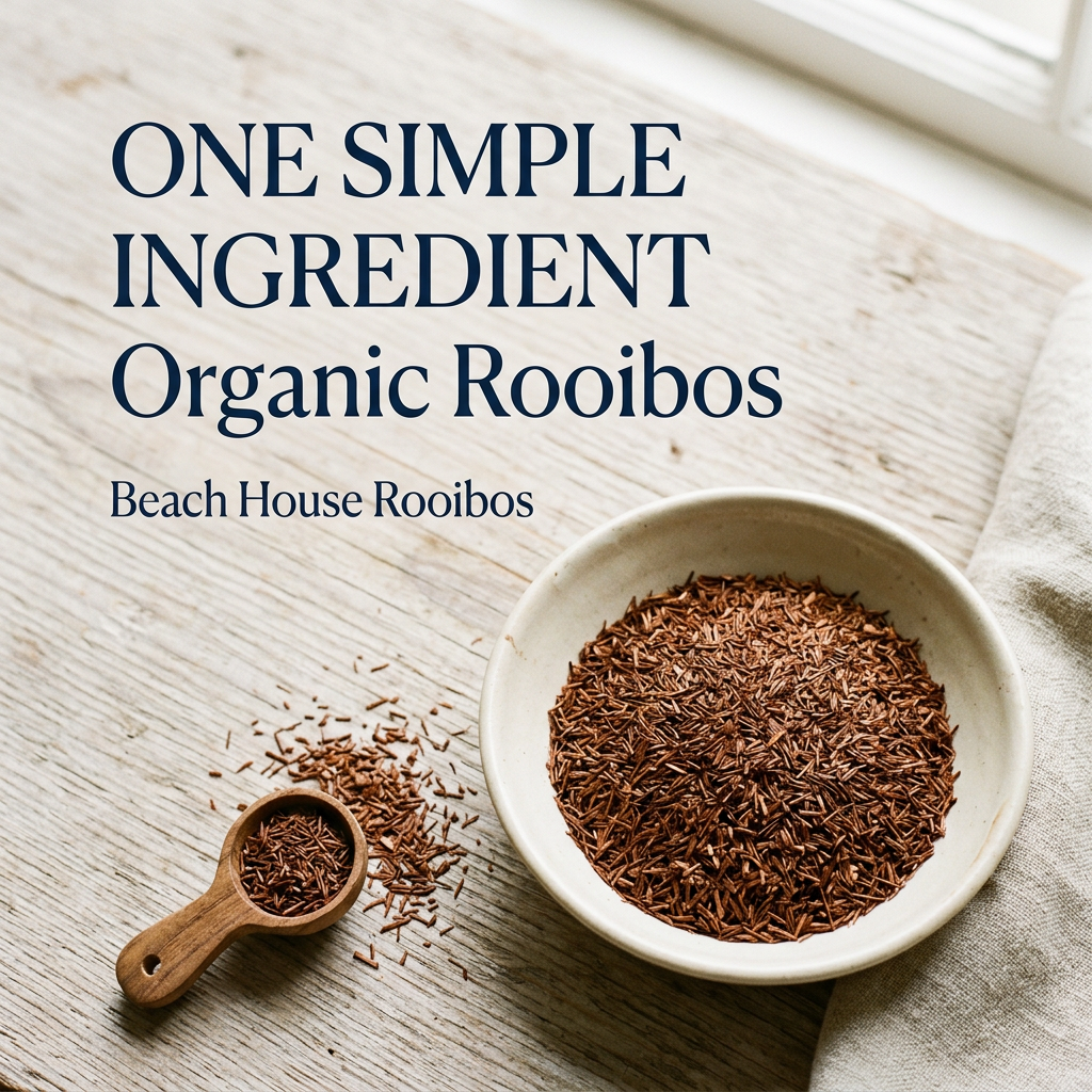 Beach House Rooibos ingredients slide: One simple ingredient, Organic Rooibos. Fine reddish-brown rooibos in a cream bowl beside a wooden scoop on pale weathered wood, without packaging.