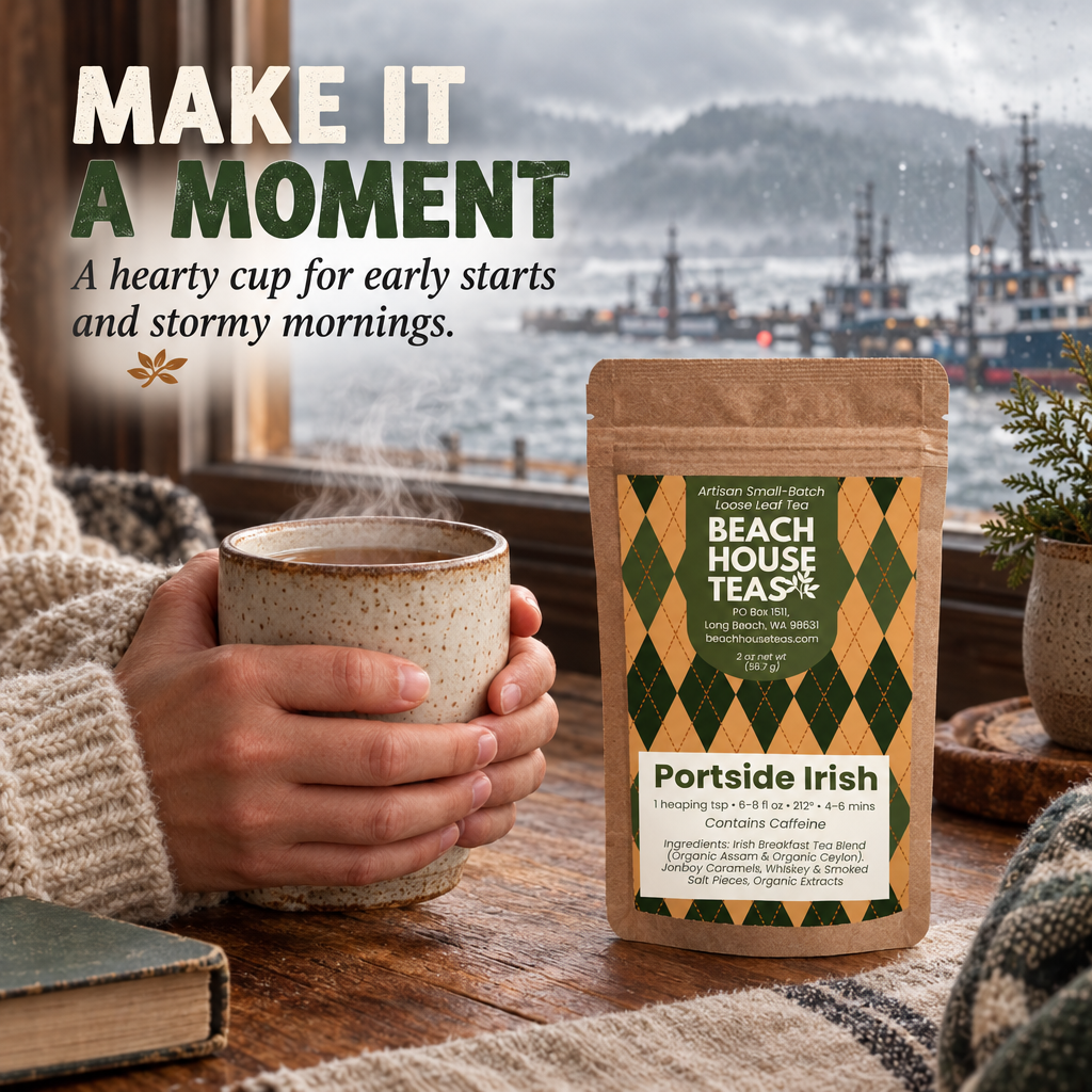 Hands in a wool sweater holding a steaming mug beside a Port Side Irish pouch overlooking a stormy harbor.