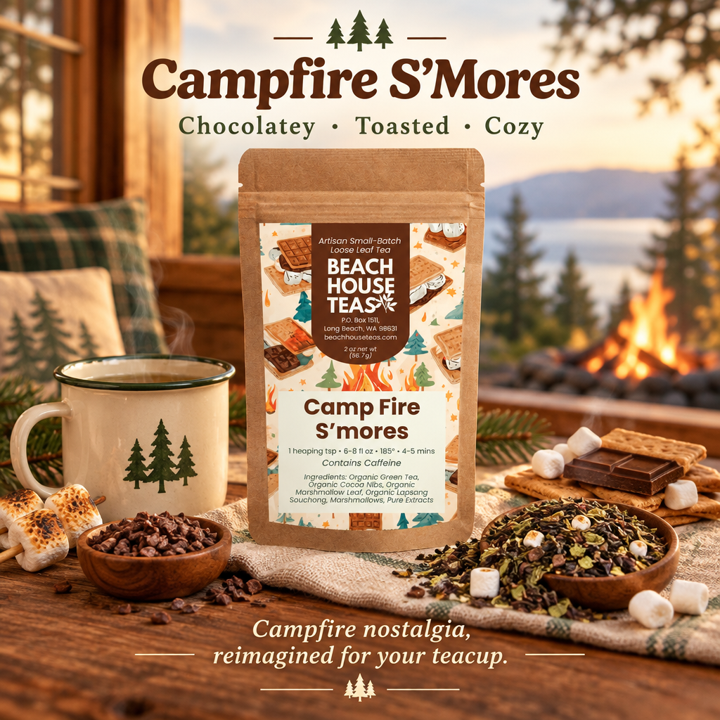 Campfire S'Mores pouch with loose tea, cocoa nibs, toasted marshmallows and enamel mug beside a coastal campfire.