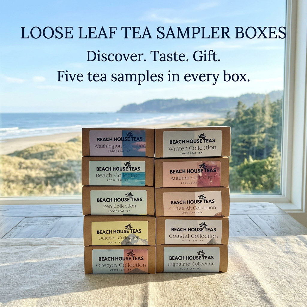 Ten Beach House Teas sampler boxes in two stacks on a stone wall overlooking the ocean and evergreen trees
