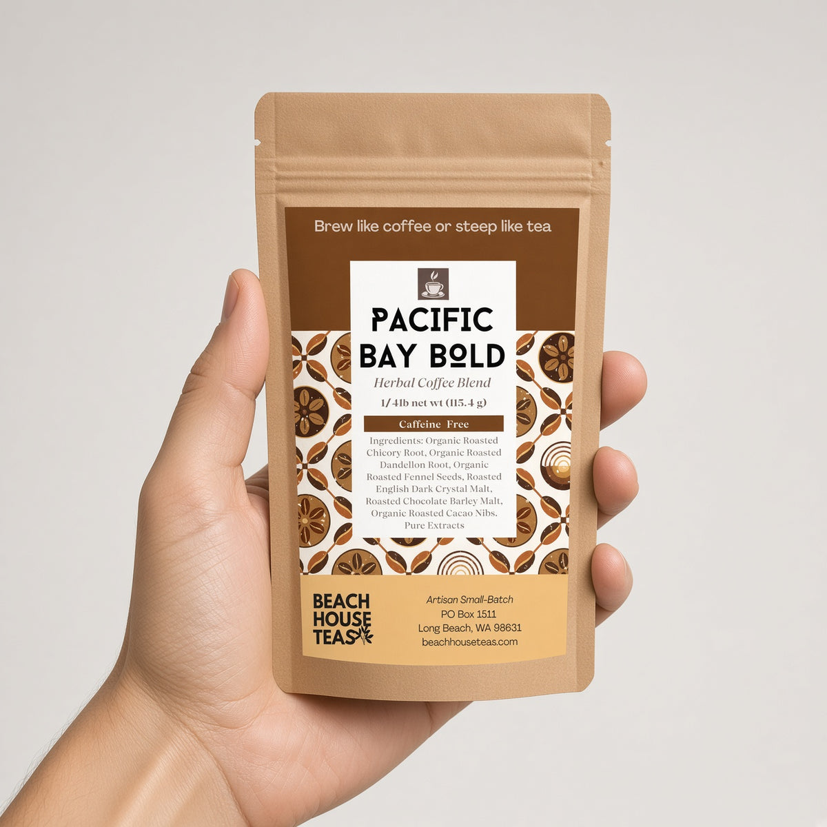 Hand holding a Pacific Bay Bold herbal coffee quarter-pound kraft pouch against a light background